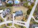 An aerial view of a lovely home showcasing the large yard, mature landscaping, and proximity to neighborhood amenities at 12878 Mayfair Ln, Carmel, IN 46032