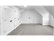 Attic or bonus room features neutral carpet, fresh paint, and closet at 12878 Mayfair Ln, Carmel, IN 46032