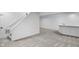 Finished basement with stairs and a wet bar; neutral decor and carpeted floor at 12878 Mayfair Ln, Carmel, IN 46032