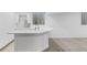 Finished basement featuring modern sink, wet bar, window, and neutral colors at 12878 Mayfair Ln, Carmel, IN 46032
