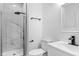 Modern bathroom with a glass-enclosed shower, sleek black fixtures, and a white vanity at 12878 Mayfair Ln, Carmel, IN 46032