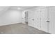 Finished bedroom space with multiple closets and an open door to the stairway at 12878 Mayfair Ln, Carmel, IN 46032