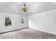 Bright bedroom featuring plush carpets, double windows and a modern chandelier at 12878 Mayfair Ln, Carmel, IN 46032