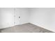 Bedroom with neutral walls, carpet, trim and a door with black hardware at 12878 Mayfair Ln, Carmel, IN 46032