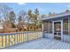 A backyard deck with a view of the fenced yard and a screened-in porch at 12878 Mayfair Ln, Carmel, IN 46032