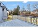 A spacious, light blue wooden deck overlooks a lush green yard and surrounding neighborhood at 12878 Mayfair Ln, Carmel, IN 46032
