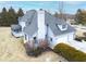 A beautiful view of a two-story home showcasing its large chimney and attached two-car garage at 12878 Mayfair Ln, Carmel, IN 46032