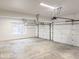 Spacious two-car garage with automatic door openers and a window for natural light at 12878 Mayfair Ln, Carmel, IN 46032