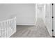 Open hallway features neutral carpet, fresh paint, and bright lighting at 12878 Mayfair Ln, Carmel, IN 46032