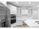 Bright kitchen featuring stainless steel appliances and white subway tile backsplash at 12878 Mayfair Ln, Carmel, IN 46032