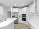 Bright kitchen featuring stainless steel appliances and a functional center island at 12878 Mayfair Ln, Carmel, IN 46032