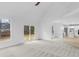 Living room boasting natural light, access to a kitchen, and backyard access at 12878 Mayfair Ln, Carmel, IN 46032