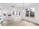 Spacious living room with fireplace, vaulted ceiling, and bright natural light at 12878 Mayfair Ln, Carmel, IN 46032