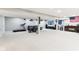 Spacious finished basement featuring a seating area, bar with stools, and a treadmill at 14402 Wolverton Way, Fishers, IN 46037