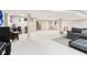 Finished basement with a seating area, bar with stools, and carpet flooring at 14402 Wolverton Way, Fishers, IN 46037