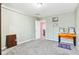 This bedroom features neutral walls, plush carpet, and a window at 14402 Wolverton Way, Fishers, IN 46037
