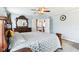 This bedroom features neutral walls, carpeted floors, and a decorative mirror at 14402 Wolverton Way, Fishers, IN 46037