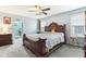 This bedroom features a decorative bed, neutral walls, and carpeted floors at 14402 Wolverton Way, Fishers, IN 46037