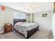 This bedroom features neutral walls, plush carpet, and ceiling fan at 14402 Wolverton Way, Fishers, IN 46037