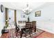 Traditional dining room with ample natural light and a decorative chandelier at 14402 Wolverton Way, Fishers, IN 46037