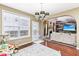 Charming dining room with hardwood floors, chandelier lighting, and view of the living room at 14402 Wolverton Way, Fishers, IN 46037