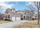 Spacious home featuring a three-car garage and a long driveway at 14402 Wolverton Way, Fishers, IN 46037