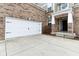 Attached two car garage with painted white doors at 14402 Wolverton Way, Fishers, IN 46037