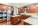 Spacious kitchen features stainless steel appliances, granite countertops, custom cabinets, and a central island at 14402 Wolverton Way, Fishers, IN 46037