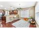 Cozy breakfast nook with counter seating adjacent to the modern kitchen at 14402 Wolverton Way, Fishers, IN 46037