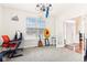 Home office with grey carpet, a chandelier, and plenty of natural light at 14402 Wolverton Way, Fishers, IN 46037