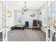 Home office with grey carpet, a chandelier, and plenty of natural light at 14402 Wolverton Way, Fishers, IN 46037