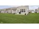 Backyard of a home with a patio, grill, and well-maintained lawn, perfect for outdoor gatherings at 16613 Grappa Trl, Fishers, IN 46037