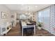 Inviting dining area with stylish chandelier, flowing into a modern kitchen and natural light at 16613 Grappa Trl, Fishers, IN 46037