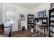 Inviting home office with a desk, shelving, and natural light from the window at 16613 Grappa Trl, Fishers, IN 46037