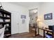 View of the home office leading into the entryway with hardwood floors at 16613 Grappa Trl, Fishers, IN 46037