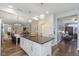 Open-concept kitchen with granite island perfect for entertaining, flowing into dining and living areas at 16613 Grappa Trl, Fishers, IN 46037