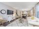 Inviting living space with a comfortable sofa, decorative rug, and open flow to the dining area at 16613 Grappa Trl, Fishers, IN 46037