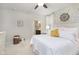 Tranquil main bedroom features a king bed, stylish wallpaper, and ensuite bathroom access at 16613 Grappa Trl, Fishers, IN 46037