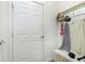 Mud room with coat hooks, storage bench, and access to the garage at 16613 Grappa Trl, Fishers, IN 46037