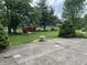 Picturesque backyard featuring lush greenery, mature trees, and a peaceful outdoor setting at 1701 Beech N Dr, Plainfield, IN 46168