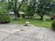 Spacious backyard with mature trees and a well-manicured lawn, offering a private outdoor retreat at 1701 Beech N Dr, Plainfield, IN 46168