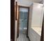 Stylish bathroom featuring a tiled floor, vanity with sink, and accessible glass-enclosed shower at 1701 Beech N Dr, Plainfield, IN 46168