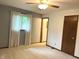 Spacious bedroom with plush carpeting, ceiling fan, and a window offering lots of natural light at 1701 Beech N Dr, Plainfield, IN 46168