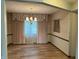 Formal dining room featuring wood floors, elegant lighting and classic décor at 1701 Beech N Dr, Plainfield, IN 46168