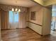 Classic dining room with wood floors, chandelier, and an open view to the kitchen at 1701 Beech N Dr, Plainfield, IN 46168