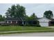 Charming brick ranch home with a well-manicured lawn and an attached two-car garage at 1701 Beech N Dr, Plainfield, IN 46168