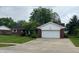 Inviting brick ranch home with attached two-car garage and a well-kept lawn at 1701 Beech N Dr, Plainfield, IN 46168