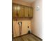 Functional laundry area featuring upper cabinets and plumbing hookups for a washer and dryer at 1701 Beech N Dr, Plainfield, IN 46168