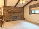 Spacious living room with vaulted ceilings, fireplace, and large window at 1701 Beech N Dr, Plainfield, IN 46168
