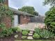 Charming backyard patio with garden featuring a seating area and access to landscaped gardens at 1701 Beech N Dr, Plainfield, IN 46168
